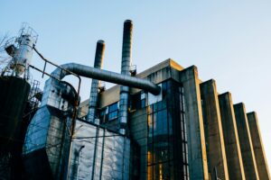 pexels photo 3939981 3939981 Low angle exterior of factory located on city street under blue sky in evening time